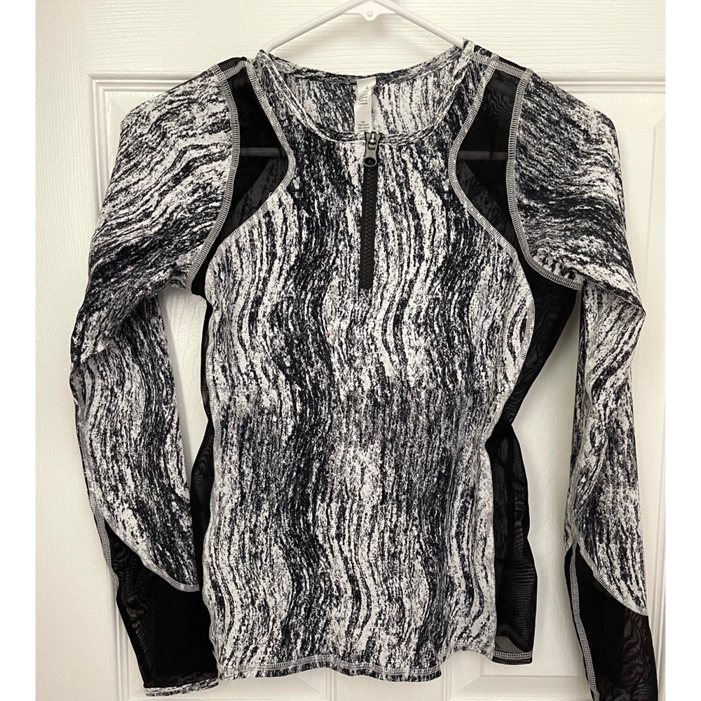 Lululemon yoga jacket with sheer paneling. NEVER WORN. NEW!!! Very unique piece!